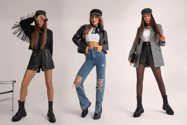 Trzy kobiety prezentują stylizacje w rockowym stylu: skórzane szorty z frędzlami, podarte jeansy i elegancki żakiet z krótkimi spodenkami.